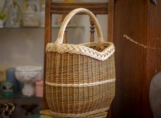 a wicker basket sitting on top of a wooden table