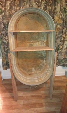 a wooden shelf sitting on top of a hard wood floor