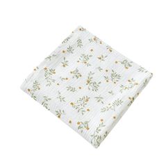 a white napkin with orange and green flowers printed on the front, sitting on a white surface