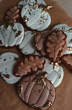 four decorated cookies sitting on top of a table