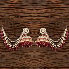 Add a regal look to your outfits with our Rani Pankhuri Earrings. These Gold-Plated beauties feature Kundan with Rani beads and a stunning Kaan chain design. Specifications Materials used: Kundan, Rani beads Length: 7.5 cm, Width: 6 cm Weight: 8.1 grams At Romikas, we pride ourselves on the craftsmanship and high quality of our jewelry, designed to enhance your natural beauty. Please contact us with any questions. Chandbali Jhumkas With Latkans For Puja, Temple Style Drop Jhumkas For Navratri, Temple Style Jhumkas For Navratri, Elegant Jhumkas With Latkans For Puja, Temple Jewelry Style Jhumkas For Navratri, Temple Jewelry Jhumkas For Navratri, Traditional Heavy Earrings For Puja, Navratri Cutdana Earrings For Puja, Navratri Latkans Jhumka Drop Earrings