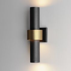 two lights that are on the side of a wall