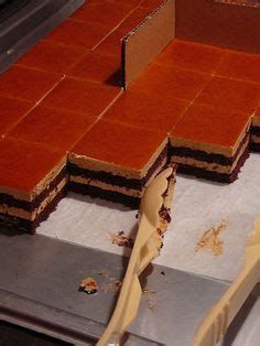 several pieces of cake sitting on top of a counter