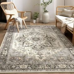 a living room with a large rug on the floor