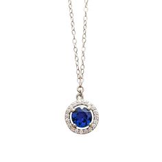 A gorgeous blue sapphire sparkles in the light, accented by a circle of diamonds. Set in 14k white gold, this is the prettiest sapphire necklace you may ever see! Handcrafted in 14k white gold Features a sapphire surrounded by a diamond halo Sapphire measures approx. 5.5mm in diameter Pendant measures approx. 10mm in diameter Full necklace hangs at 18" with a 14k lobster clasp Sapphire Jewelry With Brilliant Cut Round Stone, Sapphire Necklace With Brilliant Cut, Sapphire Necklaces With Halo Setting, Sapphire Necklace With Diamond Halo Setting, Sapphire Jewelry With Halo Design And Round Cut, Sapphire Cubic Zirconia Jewelry With Halo Design, Sapphire Halo Design Jewelry In Cubic Zirconia, Sapphire Halo Design Jewelry With Round Cut, Blue Sterling Silver Jewelry With Halo Design