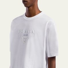 Prada T-shirt with silicone logo at chest Crew neckline Short sleeves Boxy fit Pullover style Cotton Made in Italy Lettering Logo, Round Logo, Letter T, Prada Men, T Shirt Men, Jersey T Shirt, Pullover Styling, Cotton T Shirt, White Cotton