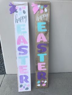 two wooden signs with the words happy easter painted on them next to eachother