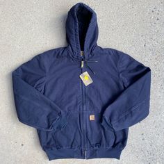 Nwt Carhartt J130 Quilted Flannel-Lined Sandstone Duck Active Jacket - "Midnight" Blue (Mdt) - Size Medium Tall New With Tags! Discontinued Style. Product Features 12-Ounce, 100% Sandstone Cotton Duck Micro-Sanded, Then Garment-Washed For A Soft Hand Feel 100% Polyester Quilted Flannel Lining In Body; Quilted Nylon Lining In Sleeves Attached Quilted Flannel Lined Hood With Drawstrings Two Inside Pockets Two Large Lower Front Hand-Warmer Pockets Triple Stitched Main Seams Rib-Knit Cuffs And Waistband Approximate Measurements (Taken Flat) Chest (Pit To Pit): 26" Length (Back Neck Seam To Bottom Hem): 30” Shoulder (Shoulder Seam To Shoulder Seam Carhartt Jackets, Men Carhartt, Carhartt Jacket, Active Jacket, Front Hand, Soft Hands, Flat Chest, Soft Hand, Knit Cuff