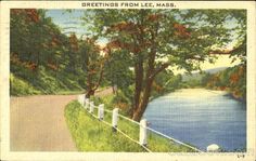 an old postcard shows a scenic view of a river, trees and a white picket fence