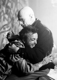 a man is hugging another man with a caption that reads, how i feel now that breaking bad is over