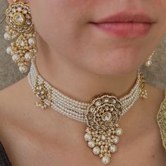 This beautiful faux kundan choker set comes with stunning long earrings and tikka  Measurements  Choker 1 Inch length plus 3 inch drop  (Adjustable string) Earring 3 Inch length x 1Inch width  Tikka 1.5 Inch length x the  inch Ready to ship! Heavy Kundan Choker For Gifts, Kundan Choker For Wedding And Eid, Luxury Bollywood Kundan Choker, Festive Kundan Pearl Choker Necklace, Gold Kundan Bollywood Choker, String Earrings, Indian Jewelry Sets, Pearl Choker Necklace, Pearl Choker