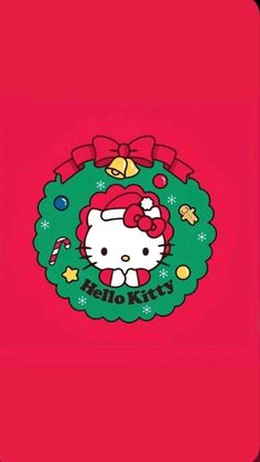 a hello kitty christmas card with a wreath and bells on it's front cover