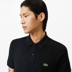 Lacoste upped the stakes in elegant sportswear game with the invention of the polo shirt in 1933. The Original L.12.12, featuring a collar, a button band and a new knit fabric, was born. The historic slim fit design features a fitted cut. Made from over 12 miles of thread, with an embroidered crocodile made up of 2367 stitches… a lesson in expertise. Fitted Classic Polo Shirt With Johnny Collar, Classic Fitted Polo Shirt With Ribbed Collar, Fitted Polo Shirt With Ribbed Collar For Golf, Formal Fitted Polo Shirt With Ribbed Collar, Classic Polo Shirt With Seamless Collar For Golf, Classic Polo Shirt With Ribbed Collar For Golf, Classic Black Polo Shirt For Golf, Classic Golf Polo Shirt With Ribbed Collar, Classic Golf Polo Shirt With Seamless Collar