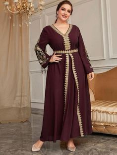 Experience the opulence and grace of our Elegant Maroon Embroidered Dress, intricately embellished with shimmering gold embroidery on the sleeves and front panel. The exquisite Guipure lace detailing adds a touch of sophistication, while the delicately embroidered waist and back tie exude elegance. Made from luxurious 100% polyester, it offers unrivaled comfort and style. Available in sizes 0XL - 4XL (US 12 - 20). **PLEASE NOTE**This item requires our "formal dresses" shipping option due to its Guipure Lace, Gold Embroidery, Current Fashion Trends, Lace Panelled, Petite Outfits, Beautiful Embroidery, Belted Dress, Embroidered Dress, Floral Embroidery