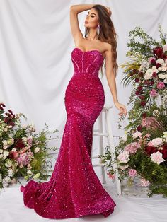 Product Code: FSWD0633 Embellishment: Sequin Fabric: 100% Polyester Back Style: Zipper Up Fully Lined: Yes Built-in Bra: Yes Available Color: Fuchsia Stretch: Moderate Fits true to size Imported Model Information: Height: 5' 2" Bust: 33.5'' Waist: 24“ Hips: 35.5” wearing US size Small Pink Fishtail Mermaid Dress For Evening, Pink Mermaid Dress For Prom, Pink Sleeveless Mermaid Dress For Prom, Pink Sequined Mermaid Dress For Party, Pink Fitted Mermaid Evening Dress, Glamorous Pink Mermaid Hem Gown, Pink Evening Dress For Pageant During Prom Season, Glamorous Pink Mermaid Party Dress, Pink Sleeveless Mermaid Evening Dress