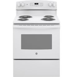 a white stove with the door open and an oven on it's left side