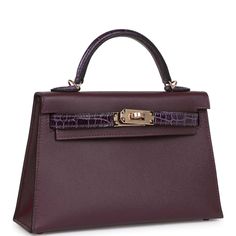 This Kelly, in the Sellier style, is in Cassis and Amethyst Madame leather and Shiny Alligator with permabrass hardware and has tonal stitching, two front straps with front toggle closure, single rolled handle and removable shoulder strap.The interior is lined with Cassis lambskin and has one open pocket on the back wall.Collection: BOrigin: FranceCondition: Pristine; new or never worn (plastic on hardware)Accompanied by: Hermès box, Hermès dustbag, shoulder strap, shoulder strap dustbag, felt, Dream Items, Mini Kelly, Hermes Box, Fancy Bags, Hermes Bags, Hermes Birkin, Luxury Handbags, Alligator, Luxury Bags