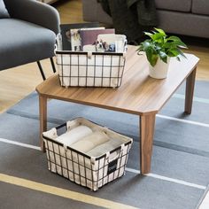 two baskets sitting on top of a coffee table