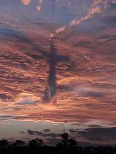 the sky is pink and blue with clouds