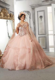 Add a touch of sparkle to your Quinceanera gown with this patterned glitter net cape with ruffle detail designed from Vizcaya by Morilee, 89326. Quinceanera Accessories, Beautiful Ball Gowns, Princess Sleeves, Ruffle Fabric, Blush Rose, Next Fashion, Blush Roses, Quinceanera Dresses, Bridal Boutique