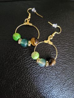 Check out this item in my Etsy shop https://www.etsy.com/listing/1252018752/green-jade-emperor-bead-and-tigers-eye Round Beaded Earrings With Natural Stones As Gift, Hoop Earrings With Round Natural Stones For Gift, Round Natural Stones Beaded Earrings As Gift, Green Hoop Earrings With Natural Stones For Gift, Spiritual Beaded Earrings With Ear Wire For Gift, Nature-inspired Dangle Beaded Earrings For Gift, Nature-inspired Beaded Dangle Earrings As Gift, Nature-inspired Dangle Beaded Earrings As Gift, Round Beads Earrings For Jewelry Making