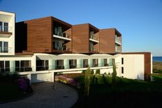 an apartment building with balconies on the second floor