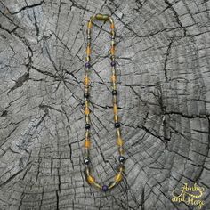 This is a one of a kind, custom made 17" necklace with a screw clasp. It has unpolished, olive shaped green and honey colored ambers in the super calming boy style. The stones included are hematite, black tourmaline, smokey quartz, purple lepidolite, and amethyst. Handmade Yellow Baltic Amber Necklaces, Handmade Baltic Amber Necklace In Yellow, Handmade Yellow Baltic Amber Necklace, Spiritual Handmade Baltic Amber Necklaces, Handmade Baltic Amber Spiritual Necklace, Handmade Baltic Amber Gold Necklaces, Spiritual Handmade Baltic Amber Necklace, Handmade Baltic Amber Necklace In Spiritual Style, Spiritual Amber Necklace