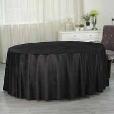 a round table with a black cloth on it