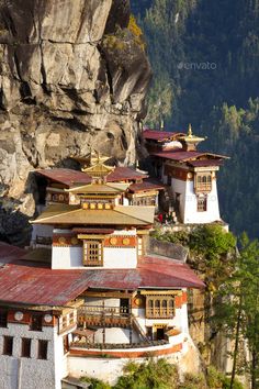 an old building on the side of a mountain