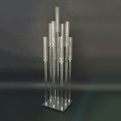 a tall glass sculpture on top of a black table