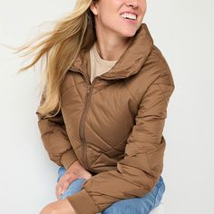 This a.n.a women's heavyweight puffer jacket is a chic yet cozy style to bundle up in when there's a chill. This quilted mid-length zip jacket has a collar neck and two pockets. Wear it over a fitted sweater with jeans. Closure Type: ZipperFit: Regular FitNeckline: Mock NeckPockets: 2 Side Zip PocketsSleeve Length: Long SleeveWarmth Factor: MidweightApparel Length: 26.5 InchesOuterwear Length: MidFiber Content: 100% PolyesterFabric Description: WovenFilling Content: 100% PolyesterLining Materia… Puffer Jacket Brown, Cozy Style, Collar Neck, Fitted Sweater, Cozy Fashion, Zip Jacket, Puffer Jacket, Mid Length, Side Zip