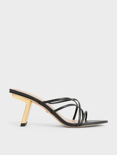 If you are looking for a pair of heels that can take you effortlessly from day to night, then these are the ones to consider. These Orly mules feature an intricate and eye-catching strappy design that will instantly elevate any look, be they formal occasionwear or casual summer fits -- all you need to do is to just slip them on and go. Sitting on metallic gold slant heels, these shoes will boost your stature with a sleek and polished finish. Sleek Evening Mules With Reinforced Heel, Chic Mules With Reinforced Heel For Night Out, Strappy Heels With Padded Heel For Cocktail, Modern Kitten Heels With Wrapped Heel For Party, Chic Strappy Heels With Sculpted Heel, Strappy Heels With Padded Heel For Night Out, Strappy Kitten Heels With Padded Heel For Party, Chic Strappy Evening Kitten Heels, Chic Strappy Kitten Heels For Evening