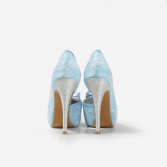 Lady Bella is a pair of custom made shoes in sweet baby blue satin. This pair of wedding heels features silky satin fabric with ivory white lace overlay. The front of this bridal heel features a dainty bow and the 4.5 inch heel of this bridal shoe is finished in silver glitter fabric. This pair of shoes is made using satin, glitter, lace, PU and other synthetic materials. They can be customized in different heel heights, colors and styles. They come with 0.5 inch elevated platform front. CUSTOMI High Heel Satin Wedding Shoes, Satin High Heel Wedding Shoes, Fitted Satin High Heel Wedding Shoes, Fitted High Heel Wedding Shoes For Ceremony, Light Blue Round Toe Evening Wedding Shoes, Elegant Light Blue Wedding Shoes For Formal Occasion, Light Blue High Heel Wedding Heels, Light Blue High Heels For Wedding, Elegant Light Blue Closed Toe Wedding Shoes