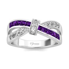 a white gold ring with purple and white diamonds