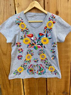 Traditional Cotton Crew Neck Shirt, Traditional Crew Neck Cotton Shirt, Spring Cotton Embroidered Top With Machine Embroidery, Cotton T-shirt With Embroidery For Spring, Bohemian Embroidered Summer T-shirt, Summer Embroidered Cotton Shirt, Cotton Tops With Machine Embroidery And Relaxed Fit, Multicolor Floral Embroidery T-shirt For Summer, Multicolor Embroidered Cotton Shirt