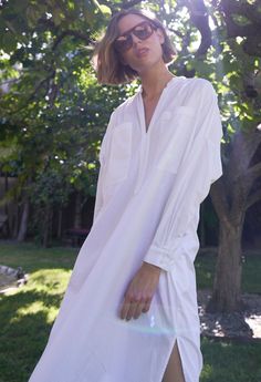 Eco friendly caftans and tunics inspired by the ocean, made on main street. Ethically sourced and locally made in Los Angeles. Inspired by French-girl chic and summers on the Cote d'Azur, meet our new favorite dress. Part shirt, part dress, part mens-wear inspired tunic, we love the oversized pockets, delicate pleats at the shoulder and generous cut. Like the majority of our dresses, this one has functional pockets, too. The cotton poplin is super soft and packs like a dream. With a shirt tail hem, pair this one with sandals or sneakers for elevated lounging or perusing your favorite market (whether its your local grocer or far away exotic bazaar). INSIDER TIP: This one is cut VERY roomy so please check the sizing tab for the best fit. Sheerness: noneFabric: 100% CottonMachine wash, hang, Summer V-neck Relaxed Fit Tunic, Spring Long Sleeve Relaxed Fit Kaftan, Daywear Relaxed Fit Tunic With Split Neck, Relaxed Fit Split Neck Tunic For Daywear, Oversized Spring Tunic, V-neck Relaxed Fit Shirt Dress For Vacation, Relaxed Fit V-neck Shirt Dress For Vacation, Spring Relaxed Fit Tunic Shirt Dress, Chic Spring Tunic With Relaxed Fit