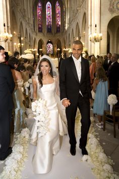 the bride and groom are walking down the aisle