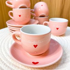 pink cups and saucers with hearts on them