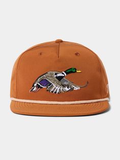 a brown hat with a duck embroidered on it