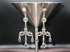 "Cheers to the bride!  This is a brilliant pair of Swarovski crystal and sterling silver chandelier earrings. On your special day, these earrings will help you sparkle! They are crafted with brilliant, sparkly Swarovski crystals placed on a sterling silver chandelier base.  They measure approximately 4\" long from the top of the sterling silver ear wire to the bottom of the longest Swarovski crystal.   Items are shipped to you in approximately 1-3 business days. Message me if you have any questions or if I can create something for you or as a gift.  All of my jewelry is handmade and arrives in a pretty, decorative box, perfect for gift giving! Please go to my shop to view my current listings: AlluringAccessoriesP Thank you for visiting my shop!" Swarovski Crystal Chandelier, Crystal Place, Silver Chandelier Earrings, Silver Chandelier, Crystal Chandelier Earrings, Silver Earrings Handmade, Swarovski Crystal Earrings, Swarovski Earrings, Earrings Sterling Silver