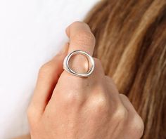 "\"Circle\" Sterling Silver Ring / Polished.  Handmade Sterling Silver Ring. The circle has an organic circle shape 16mm-17mm round. It does not have a completely round shape. The band is 4mm wide and 2mm thick. The top part is 2.2mm tall. SHIPPING AND PROCESSING TIME NOTE : I NEED 5-10 BUSINESS DAYS TO CUSTOM MAKE THIS RING FOR YOU.  I ship worldwide With Registered post and the delivery time varies. For example, there is an average 2-3 weeks for USA and 1-2 weeks for Europe. UPGRADES AVAILABLE! When you choose an upgrade then I ship by either DHL or UPS and the delivery time is 1-4 business days depending the country. Please do let me know if you have any questions at all. Thank you," Plain Silver Rings, Summer Rings, Handmade Sterling Silver Rings, Tiny Rings, Friendship Rings, Circle Ring, Handmade Rings, Rings For Girls, Small Rings