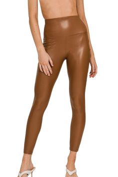 Step up your style game with our Camel Faux Leather Leggings, the perfect blend of fashion and comfort. Made from a 95% polyester and 5% spandex blend, these high-rise leggings provide just the right amount of stretch for a flattering and comfortable fit that moves with you. Whether you’re running errands or heading out for a night on the town, these leggings will be your go-to for effortlessly chic looks. Designed with an ankle-length cut and an inseam of approximately 26.75", they hug your cur Camel Leather Pants Outfit, Camel Leather Pants, Leather Pants Outfit Winter, Leather Legging, Stylish Leggings, Chic Coat, Ankle Length Leggings, Comfy Leggings, Leather Finish