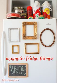 magnets and frames are on top of a refrigerator