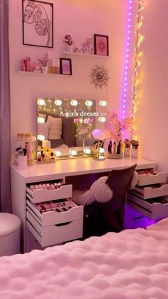 a bedroom with pink lights on the wall and white furniture in front of a mirror