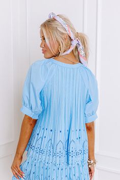 - Step into southern flair with this darling top! Its pleated texture and eyelet accent give it luxe style to elevate your look. Whether you are meeting up for tea on the patio or simply running your daily errands, this darling top will give you a touch of sweet southern charm. - Unlined pleated material with eyelet accents at the bottom - A round neckline - A buttoned front - Short sleeves with cuffs featuring smocked back details - A relaxed silhouette that ends in a scalloped hemline Pleated Tops For Summer Day Out, Casual Pleated Tops For Spring, Short Sleeve Pleated Blouse For Spring, Pleated Short Sleeve Blouse For Spring, Spring Pleated Tops, Summer Daywear Tops With Pintucks, Chic Spring Tops With Pintucks, Chic Tops With Pintucks For Spring, Chic Summer Blouse With Pintucks