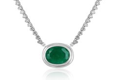 This necklace is not for the faint of heart! Featured here is a stunning oval Colombian emerald and diamond necklace made in fine 14K white gold. Displayed is a rich, dark green oval emerald with very good eye clarity for its huge 9.09-carat size. Brilliant round diamonds hug your neck with a sleek golden link chain that follows through the back.  Setting Style: Prong/ Bezel  Setting Material: 14k White Gold Stone: Colombian Emerald Shape: Oval Cut  Luster: Very Good Color: Dark Green Saturation: Dark Total Carat Weight: 9.09cts Measurements: 16.19 mm x 12.0 mm Eye Clarity: Translucent Origin: Colombia Treatment: Natural, Oiling Secondary Stone: Diamond Shape: Brilliant Round Weight: 1.74tcw Clarity: VS-SI Color: H-J Luster: Excellent Treatments: Natural If you have a special request for a Exquisite Oval Necklace With Single Cut Diamonds, Formal Oval Necklace With Single Cut Diamonds, Exquisite Oval Diamond Necklace Gift, Exquisite Oval Diamond Necklace With Accents, Luxury Oval Emerald Necklace For May Birthstone, Exquisite Oval Diamond Necklace For Gift, Oval Necklace With Diamond Accents, Oval Diamond Necklace With Polished Finish, Oval Single Cut Diamond Necklaces As Gift