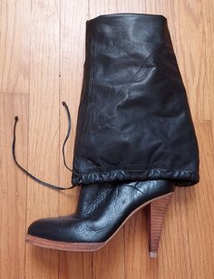 Pirate Santa, You. Dress up/down. Chimney stack boots are VINTAGE 80's Bear Traps. Luxe soot-black, dark as can be. The burnished leather is supple and smooth. Over the knee height, to cuff or not. A leather tie at the drawstring top. Almond shape toe, minimal platform. Heel stack is 3-3/4". Tread bottom. Black leather lining with stockinette. Labeled size 5.5M. Check measurements to compare. May fit a size 6 or 7 also. Made in Brazil. VINTAGE Sole width: 3"  Length: 9-1/4"  Extended height: 25-1/4" floor to cuff top Cuffed Top, Drawstring Top, Slouched Boots, Over The Knee, Boot Shoes Women, Black Leather, Shoe Boots, Cuff, Dress Up