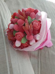 a bouquet of gummy bears on top of a bed