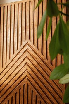 a close up view of wood panels with green leaves on the top and bottom part