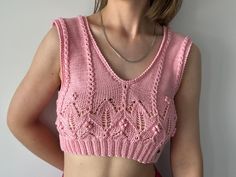 Summer crop top "TULIP" 🌷 ▪️Handmade knitted from 100% cotton. ▪️Size: S-M ▪️Color: Pink Light summer top is perfect for sunny day as well as for evening outings 🌸☀️ In this top your skin breathes and you shine brightly 🤩 Available in one copy, original flowery pattern 😃 How to care: ▫️hand wash in cool water ▫️dry on a flat surface, you can use a towel 🔺Do not iron You can ask me for exact dimensions. Ready to be shipped 📦 Thank you for visiting my shop! Fitted V-neck Pink Crochet Top, Spring Cropped Pink Knit Top, Fitted Pink Cropped Knit Top, Spring Pink Cropped Knit Top, Pink Fitted Cropped Knit Top, Summer Beach Crop Top In Pointelle Knit, Pointelle Knit Crop Top For Summer Beach, Trendy Pink Crochet Top, Trendy Pink Knit Top For Summer